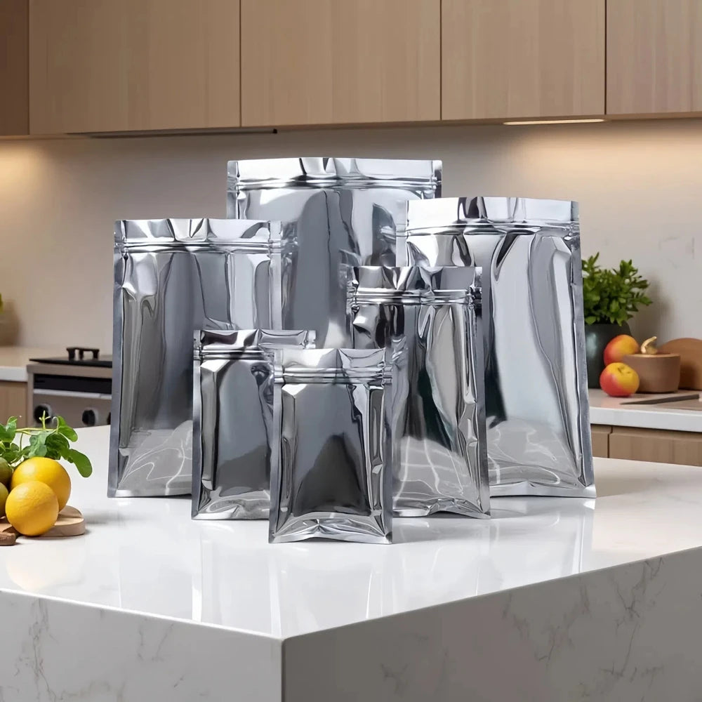 100 шт. плоских глянцевых серебристых алюминиевых фольгированных пакетов с застежкой-молнией, идеально подходящих для хранения чая, закусок, специй и кофе, многоразовые упаковочные пакеты 
