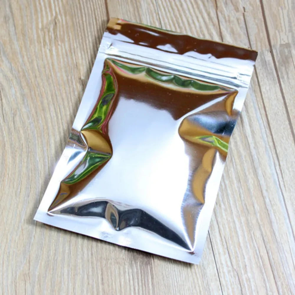 100 шт. плоских глянцевых серебристых алюминиевых фольгированных пакетов с застежкой-молнией, идеально подходящих для хранения чая, закусок, специй и кофе, многоразовые упаковочные пакеты 